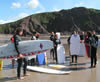 The guys about to try surfing, getting a little friendly instruction from Chris...