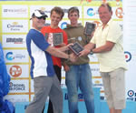 Xavier, unknown, and Dan simpson receiving the prizes from Ian Jones.