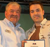 Andrew receiving his award from the RYA